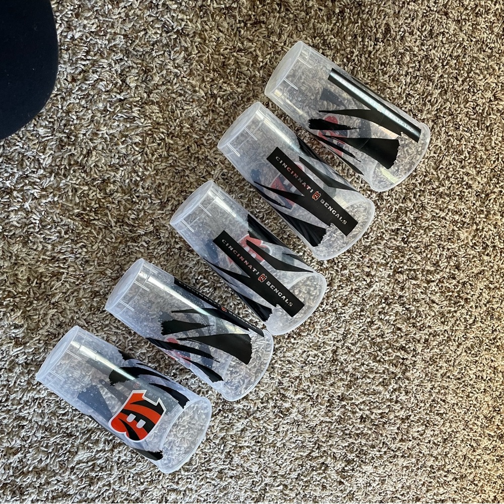 Plastic bengals cups. Used once but you can see where the design is Chipping
